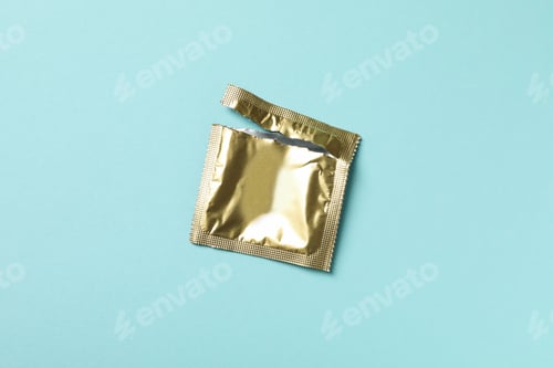 Preview: Empty blank condom packaging on blue background