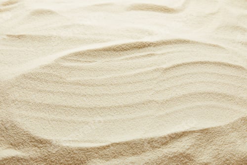 Preview: textured wavy golden sand background with copy space