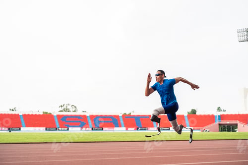 Preview: Asian para-athletes disabled with prosthetic blades running at stadium.