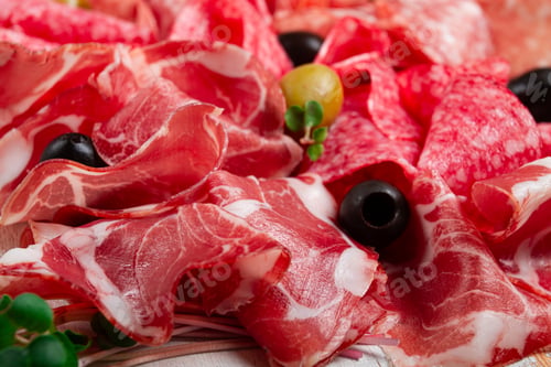 Preview: Assorted, meat appetizer, prosciutto, salami and ham, with olives , close-up, breakfast, top view,