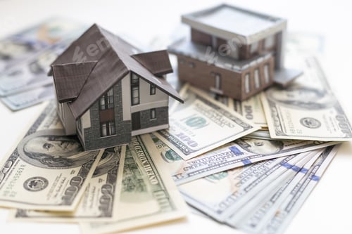 Preview: paper house model on background of US dollars banknotes. Housing market, purchase or rental of real