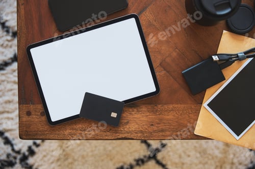 Preview: Digital tablet with debit card and smart phone on table
