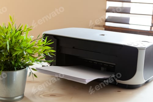 Preview: Close up of an office table with printer on it