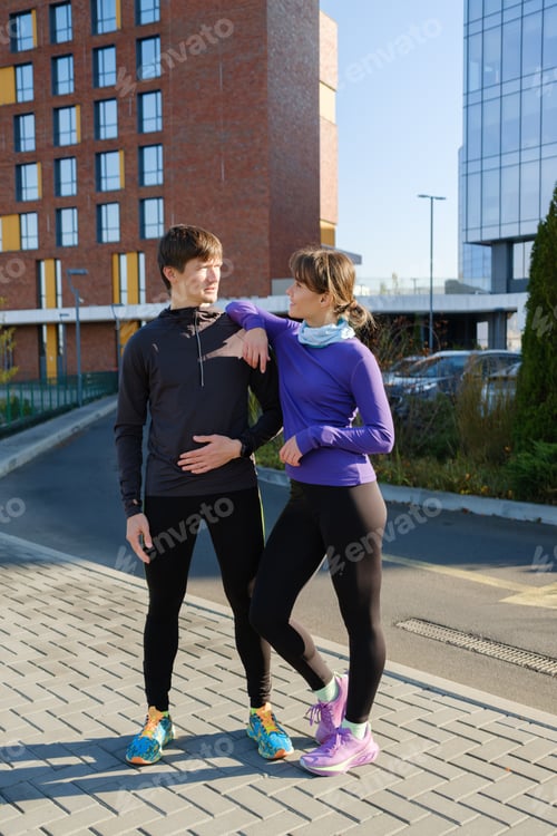 Preview: Couple enjoying an outdoor jogging session in urban environment during daytime