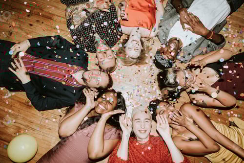 Preview: Group of friends lying on the floor at a party