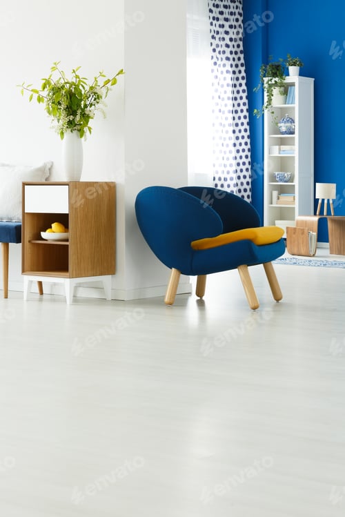 Preview: Blue chair in white room