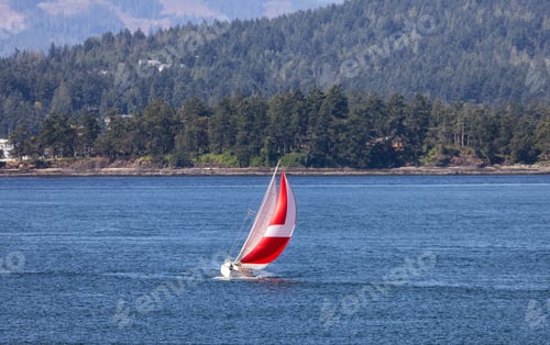 Preview: Sailboat in Canadian Landscape by the ocean and mountains.