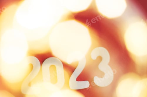 Preview: wooden number 2023 on christmas shiny gold and red background. sparkle festive blurred bokeh