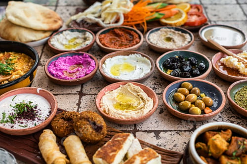 Preview: Turkish Village Breakfast on the ceramic table with pastries, vegetables, greens, spreads, cheeses