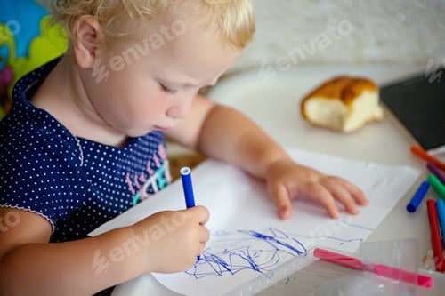 Preview: Child's hands drawing drawing with blue felt-tip pen