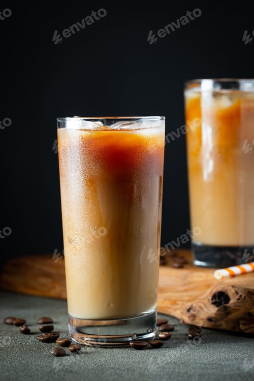 Preview: Ice coffee in a tall glass with cream.