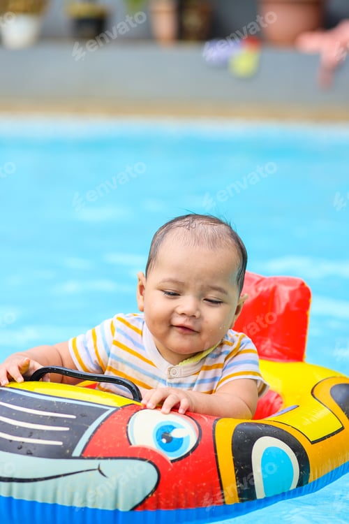 Preview: Cute baby swimming at pool
