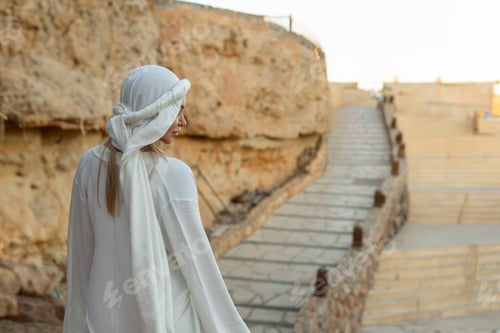 Preview: Portrait of a beautiful woman in Arabic clothing in Egypt during sunset.