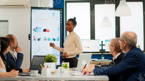 Preview: African american coach giving corporate presentation for businesspeople
