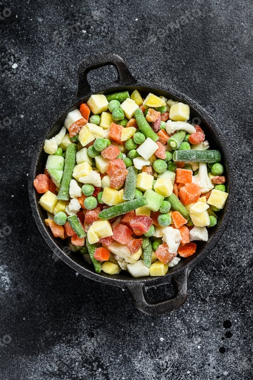 Preview: Frozen vegetables. broccoli, cherry tomatoes, corn, pea, carrot. Black background. Top view