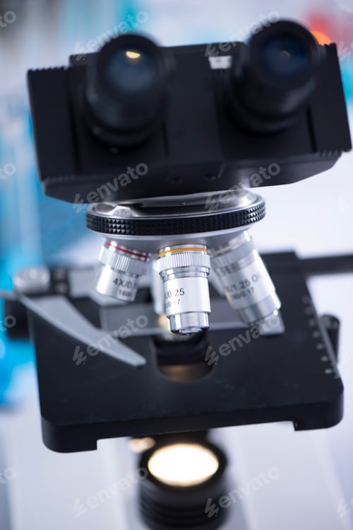 Preview: modern scientist uses a microscope in a laboratory