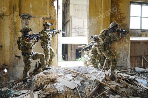 Preview: Soldier in full US MARSOC armed with assault rifle run through the abandoned building. Military