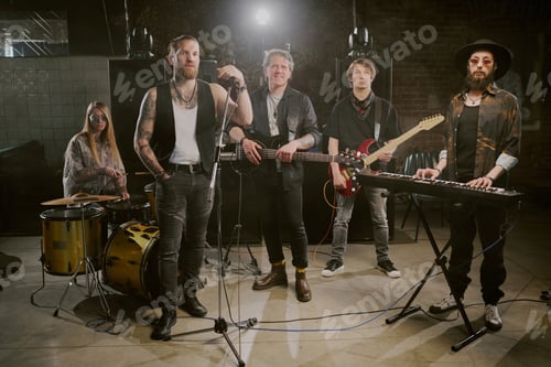 Preview: Rock Band Posing For Camera With Instruments