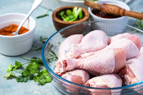 Preview: Raw Chicken Legs Drumstickswith Skin in Bowl. Food for BBQ Grill Preparation