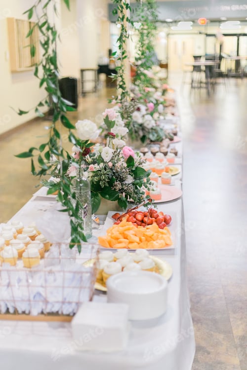 Preview: Beautiful event dessert table with flowers and cupcakes