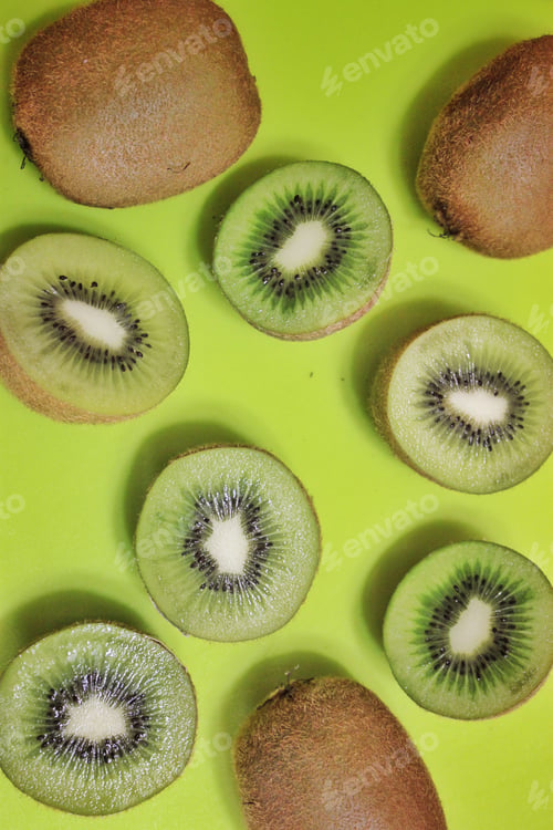 Preview: Delicious Fresh Kiwi Fruit Slices on Green Background