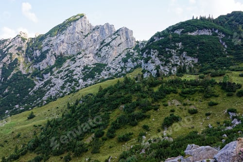 Preview: Picturesque mountain landscape with green hills.