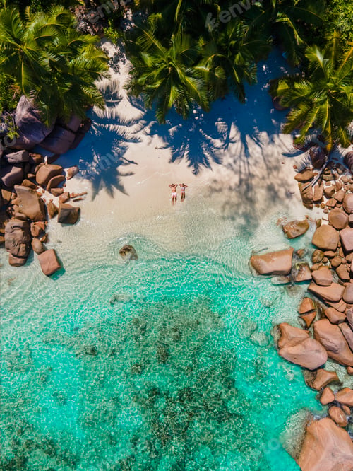 Preview: Praslin Seychelles tropical island with withe beaches and palm trees, couple men and women mid age