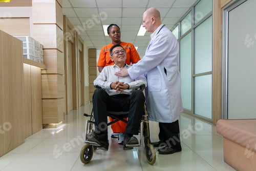 Preview: Doctor and nurse supporting happy recovering patient