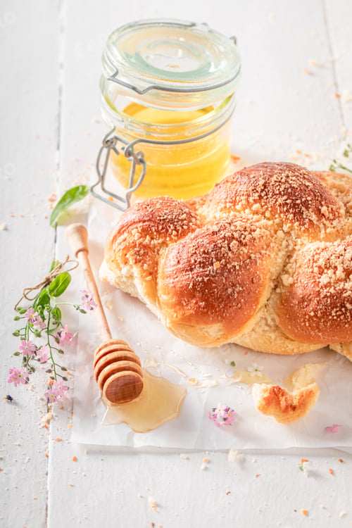 Preview: Homemade and hot golden challah with honey and milk.