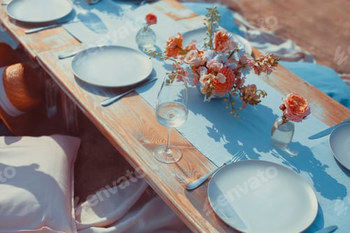 Preview: Delicious food and flowers for outdoor summer or spring picnic. Lunch on the beach in romantic color