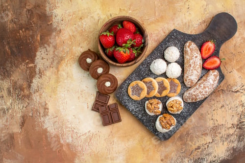 Preview: top view different sweets with cookies and fruits on light desk fruit pie cake