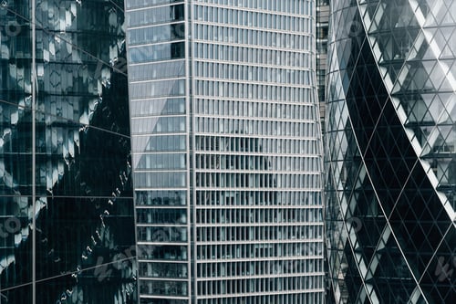 Preview: Abstract view of glass curtain wall in modern office buildings with reflection
