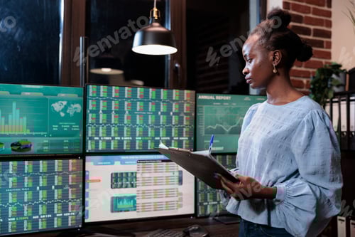 Preview: Forex stock market professional trader with clipboard standing in front of workstation