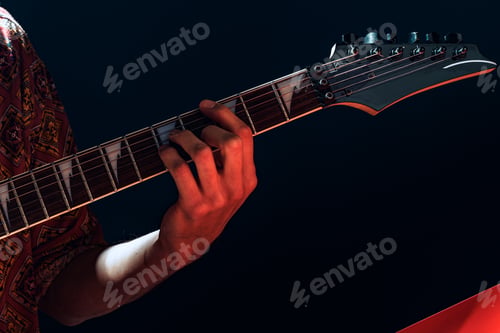 Preview: Close up photo of male hands playing guitar