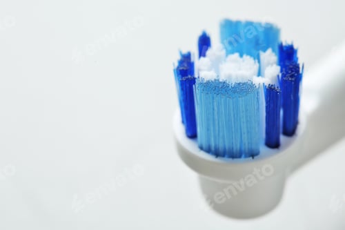 Preview: Electric toothbrush on gray background, close up