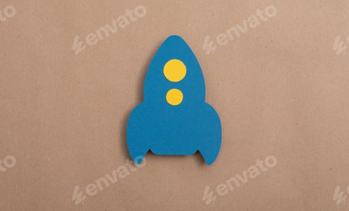 Preview: Blue rocket cut out of paper -business start up idea