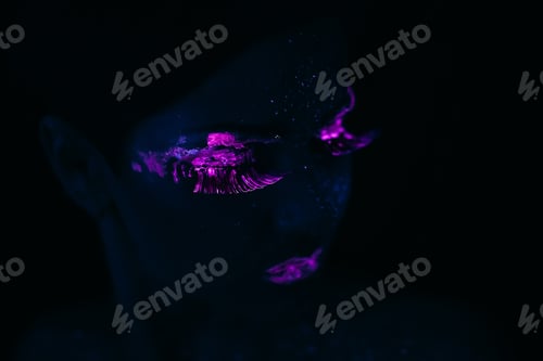 Preview: Portrait of Beautiful Fashion Woman in Neon UF Light. Model Girl with Fluorescent Creative