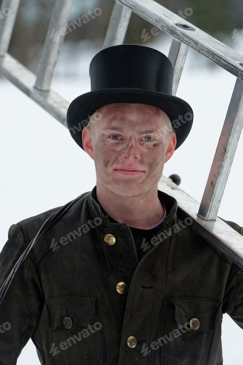 Preview: Germany, portrait of chimney sweep with ladder wearing top hat