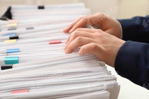 Preview: Woman working with documents in office, closeup
