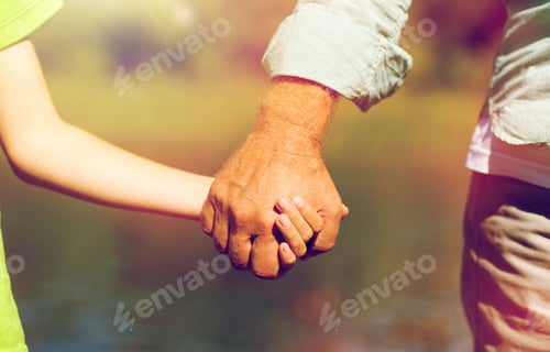 Preview: senior man and child holding hands