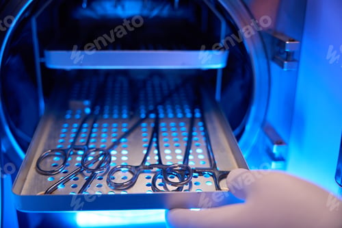 Preview: Close up of cropped doctor hand opening medical tool cabinet with scalpels