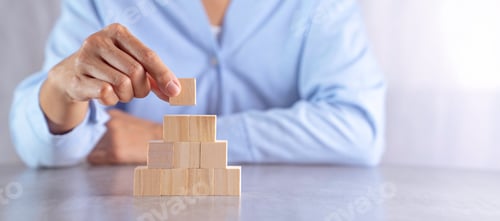 Preview: hand stack woods block step on table. business development concept.copy space.