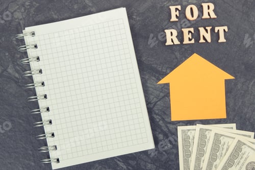 Preview: Inscription for rent, dollar and notepad for notes. renting house or flat concept