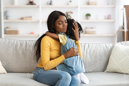 Preview: Caring African American Mom Comforting Upset Little Daughter At Home