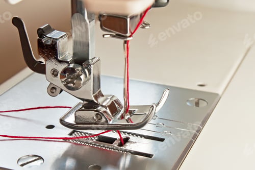 Preview: sewing machine presser foot and needle with red thread