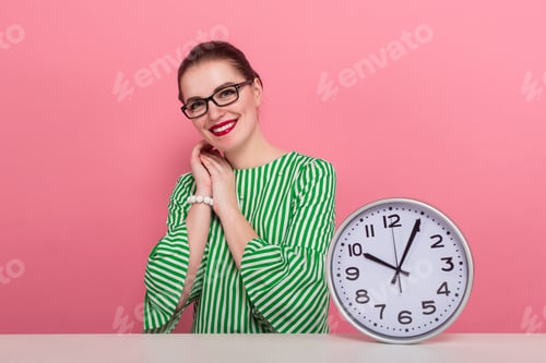 Preview: Businesswoman with hair bun and clocks