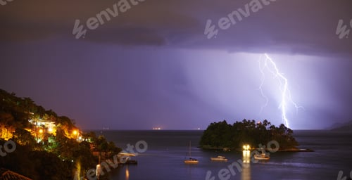 Preview: The perfect view. Shot of a dramatic thunderstorm over sea and land.