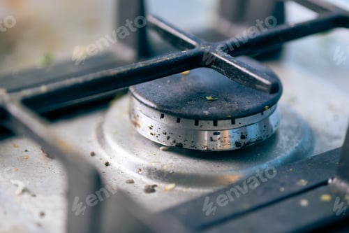 Preview: Dirty stove top with oil splatters, fat stains and food leftovers
