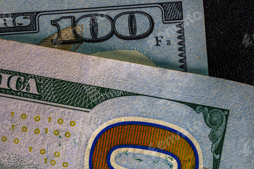 Preview: Closeup of 100 US dollar money banknotes - inflation and economy concept