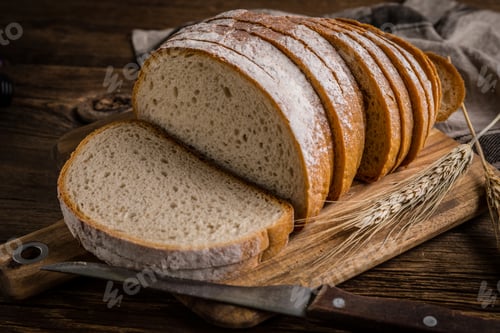 Preview: Sliced loaf of bread on a chopping board.